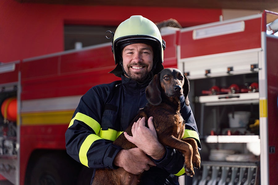 Fire Fighter With Puppy